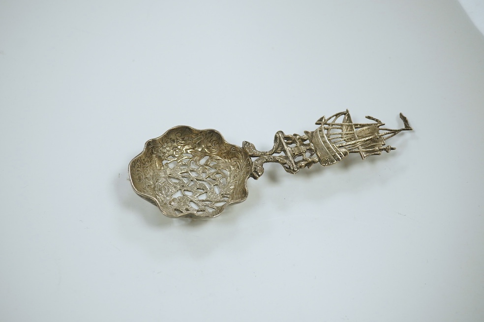 A Victorian Scottish embossed silver King's pattern caddy spoon, Millidge & Son, Edinburgh, 1854, 10.5cm, together with a later silver caddy spoon, a silver Hanau spoon and three other continental white metal spoons incl